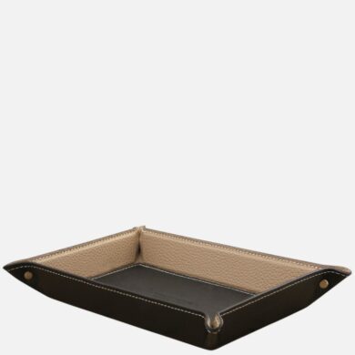 Leather valet tray with dark exterior and tan interior for organizing small items on a desk or dresser.