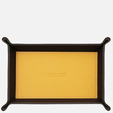 Leather tray with dark brown sides and yellow inner pocket, stitched edge detail visible around the border.