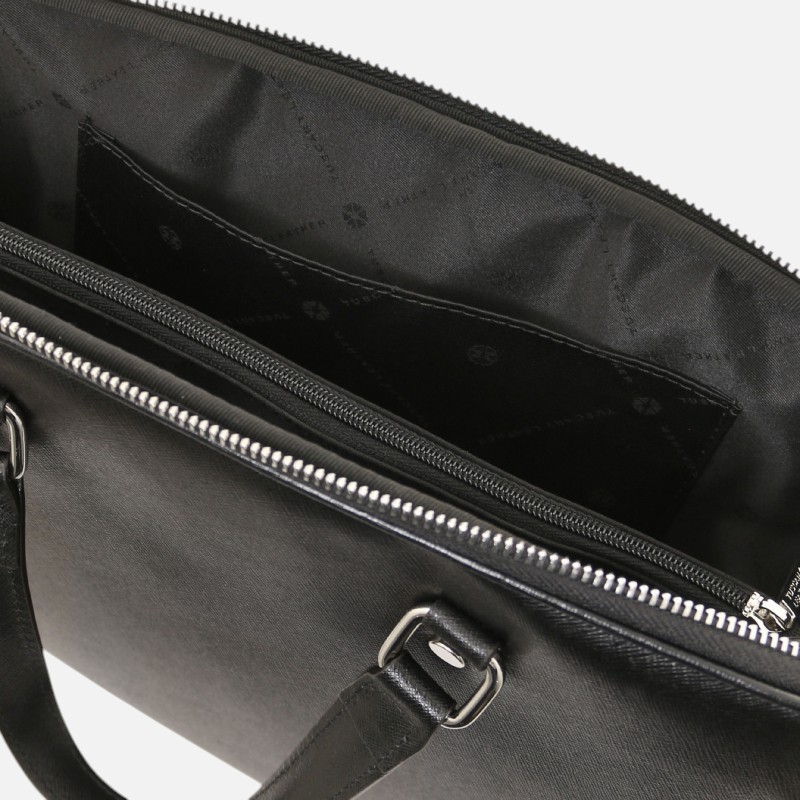Black leather shoulder bag opened to reveal a zippered main compartment and an interior slip pocket with stitched detailing on the lining.