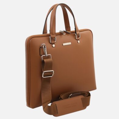 Brown leather tote-style bag with top handles and an adjustable removable shoulder strap, front view