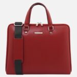 Red leather briefcase with top handles and a detachable black shoulder strap on the side.