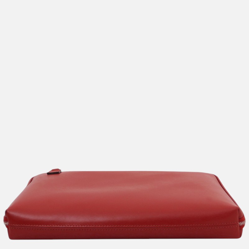 Red leather clutch-style pouch laid flat on a white background with a visible zipper along the bottom edge
