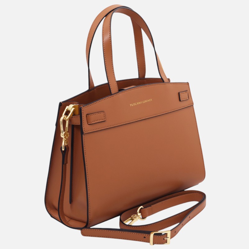 Brown leather tote with two top handles and a detachable shoulder strap, gold hardware