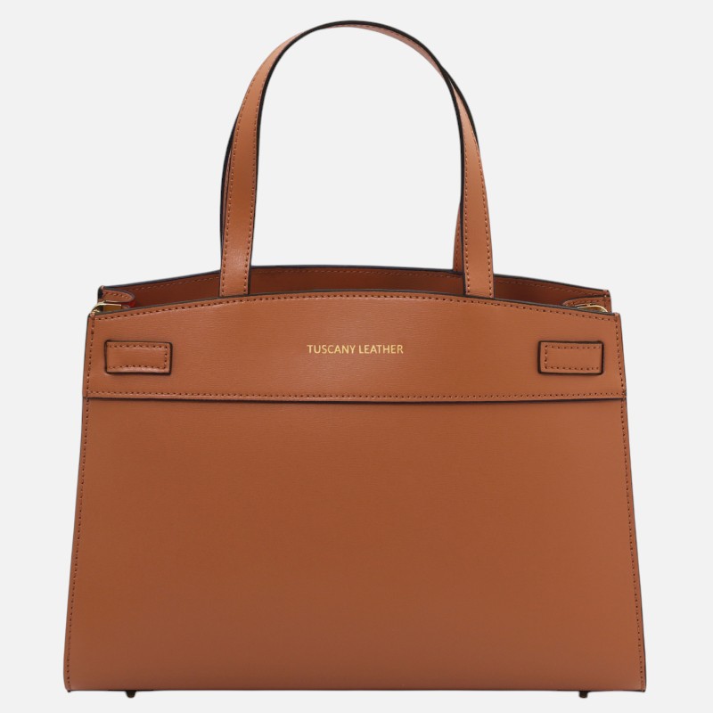 Tan leather tote bag with two handles and gold 'TUSCANY LEATHER' branding on the front.