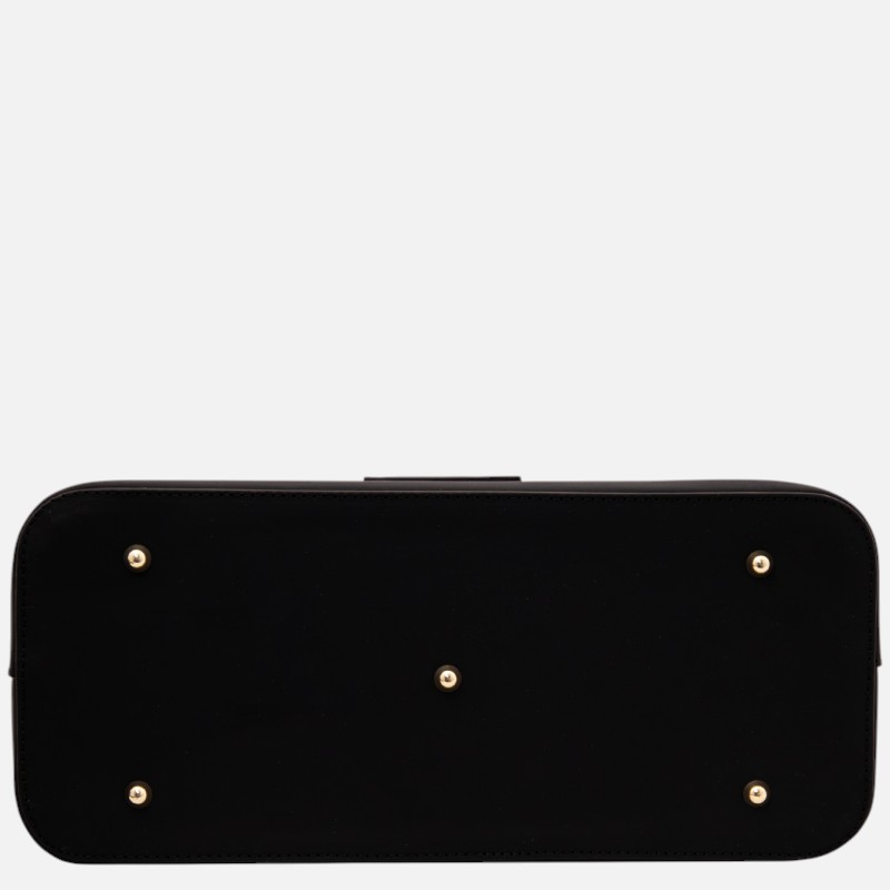 Bottom view of a black leather rectangular clutch with five gold-toned metal feet.