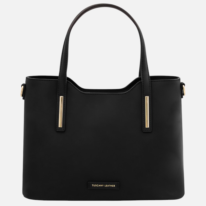Black leather tote bag with two top handles and gold vertical accents, brand label reads 'Tuscany Leather' on the front.