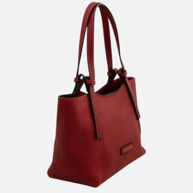 Red leather tote bag with two long handles, stitched edges, and a small front logo plaque