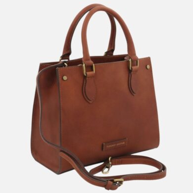 Brown leather tote bag with two top handles and a detachable shoulder strap, brass hardware, and stitched edges.