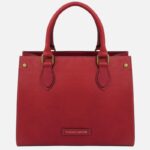 Red handbag with two handles and brass hardware, Tuscany Leather label on the front.