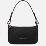 Black leather shoulder bag with gold-tone zipper and small brand plaque reading 'Tuscany Leather' on front tag