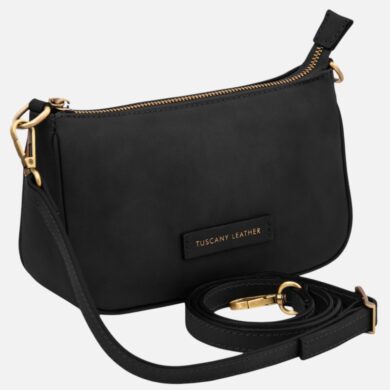 Black crossbody bag with gold zipper and hardware, labeled Tuscany Leather