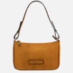 Tan leather shoulder bag with a long strap and a small brand label reading 'TUSCANY LEATHER' on the front.