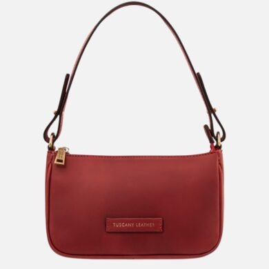 Red leather shoulder bag with a rounded bottom, top zipper, and a gold-toned zipper pull; brand tag reads Tuscany Leather on the front.