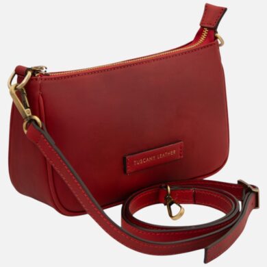 Red leather crossbody bag with a detachable strap, gold-tone hardware, and a small Tuscany Leather label on the front.