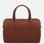 Brown leather handbag with twin top handles and gold-toned hardware, front brand patch reading 'Tuscany Leather'