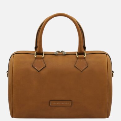 Tan leather handbag with two top handles and a small brand plaque reading Tuscany Leather on a white background.