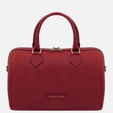 Red leather handbag with two top handles, gold-tone hardware, and a zip closure (front label reads 'Tuscany Leather').