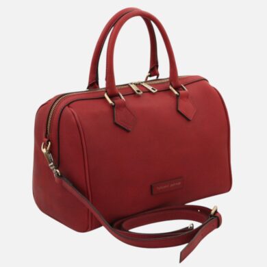 Red leather handbag with two top handles, gold zippers, and an optional long strap for crossbody wear, branded Tuscany Leather