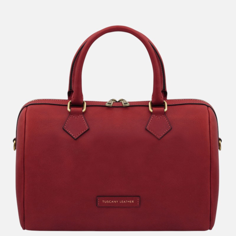Red leather handbag with two top handles, gold-tone hardware, and a zip closure (front label reads 'Tuscany Leather').