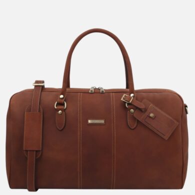 Brown leather travel duffel bag with two top handles, metal hardware, and a branded luggage tag.