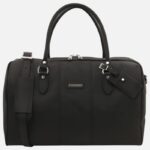 Black leather handbag with two short handles, zip top, detachable shoulder strap, silver hardware, and a metal brand plaque on the front.