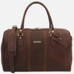 Brown leather duffel bag with top handles, gold hardware, and a detachable shoulder strap.