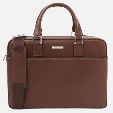 Brown leather briefcase with two top handles and a detachable shoulder strap, front zip pocket visible.
