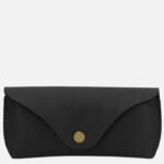 Black leather compact wallet with a fold-over flap and brass snap closure