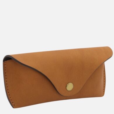 Tan leather envelope-style wallet with curved flap and brass snap button