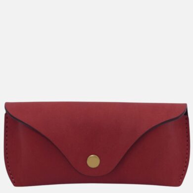 Red leather wallet with a curved flap and a gold snap button on the front