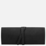 Black leather wallet with a wraparound strap, minimalist design, Tuscany Leather brand subtly inscribed on the front.