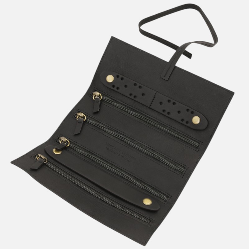 Black leather wallet opened to reveal multiple zippered pockets and a wrist strap, with gold-tone hardware on a light background.