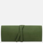 Green leather wallet with a tied wrap strap and subtle Tuscany Leather branding on the front surface.