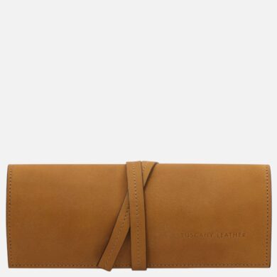 Tan leather wallet with a wraparound strap closure and stitched edges, branding visible on the lower right (Tuscany Leather).