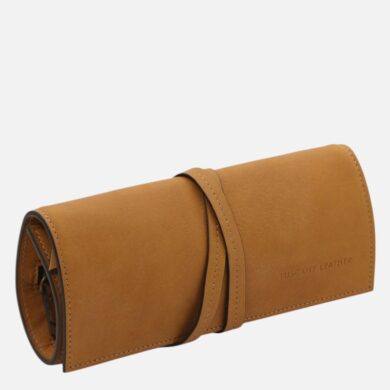 Tan leather roll-up glasses case with a wrap strap and embossed 'Tuscany Leather' text on the side