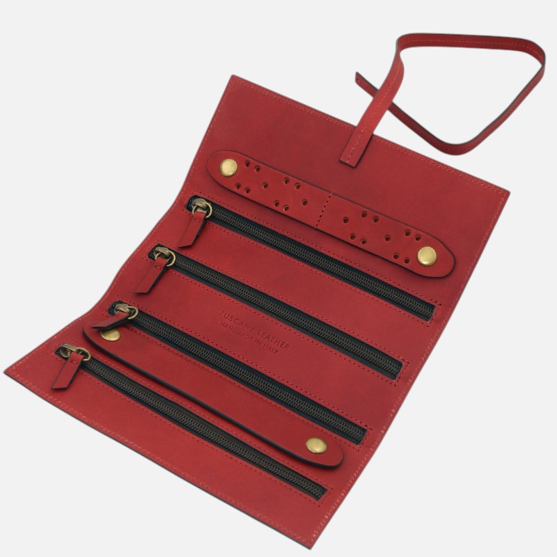 Red leather multi-zip organizer with four horizontal zip compartments and a detachable strap, handmade in Italy.