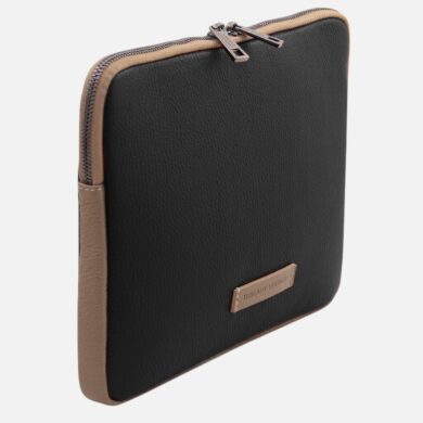 Black square leather zippered pouch with tan edges and a small metal brand plate on the front