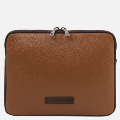 Brown pebbled leather zippered case with dark trim, labeled Tuscany Leather on the front center, likely a tablet or small laptop pouch.
