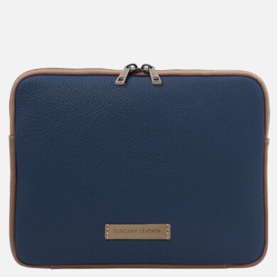Navy blue leather bag with tan trim and two zipper pulls, front label reading 'Tuscany Leather'.