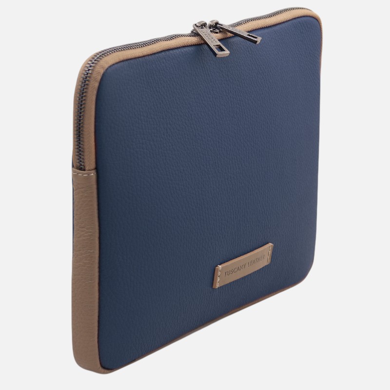 Blue leather zippered case with tan trim and rounded corners; metal zipper pulls and a small brand plate on the front.