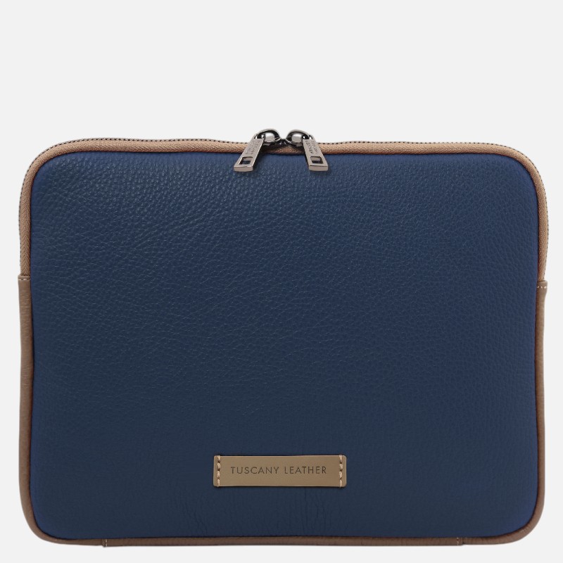 Navy blue leather bag with tan trim and two zipper pulls, front label reading 'Tuscany Leather'.