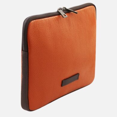 Orange leather zippered case with dark brown edges and a small label on the front.