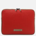 Red leather square bag with tan trim and dual top zippers, Tuscany Leather badge on front edge.