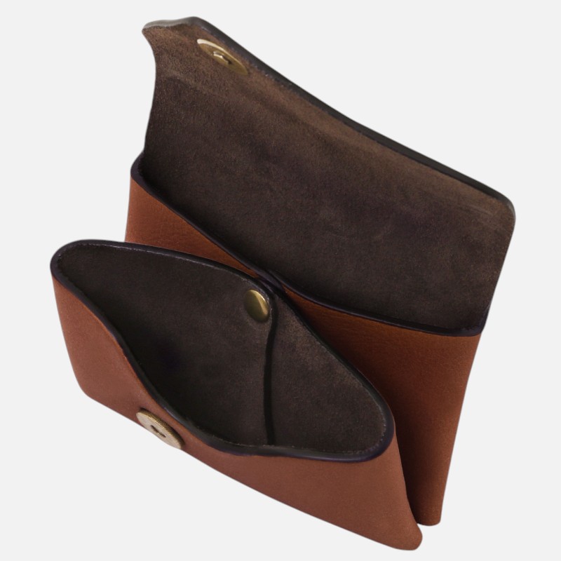 Brown leather wallet open to show dark suede interior and a small brass snap pocket.