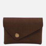 Brown leather envelope-style clutch wallet with a brass snap closure on a light background