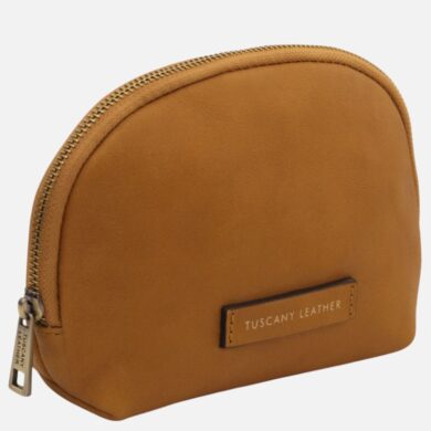 Tan leather coin purse with a curved top zipper and a small Tuscany Leather tag on the front.