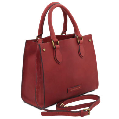 Red leather tote with double top handles, gold hardware, and a detachable shoulder strap on a white background.