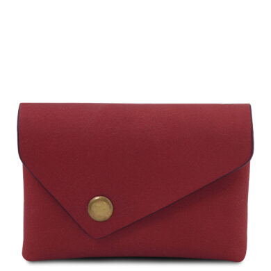 Red envelope-style clutch purse with a brass snap closure on a red surface.